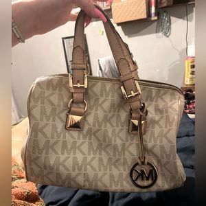 This is a medium Michael kors bag and it is used.